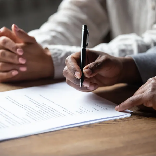 A couple with bad credit successfully signing a contract for a loan.