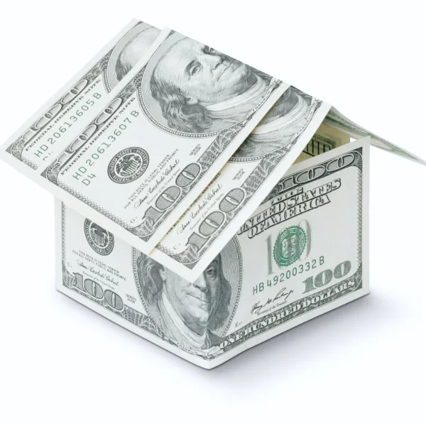 A house constructed from stacks of money, set against a clean white background, symbolizing financial prosperity and online loans.
